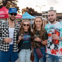 two couples smiling and posing for camera during Wyandotte's Beer Fest